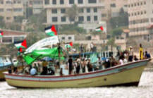 Palestinians wait aboard small fishing vessels for the arrival of the Free Gaza Movement on Saturday afternoon. (Eman Mohammed, Maan Images)