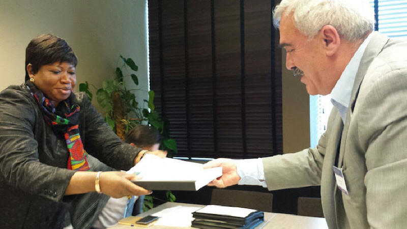 Al Haq director Shawan Jabarin presents submission from Palestinian rights organisations to ICC Prosecutor Fatou Bensouda in November 2015